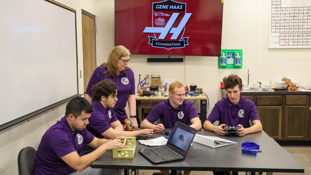 Robot group discussing strategy over table
