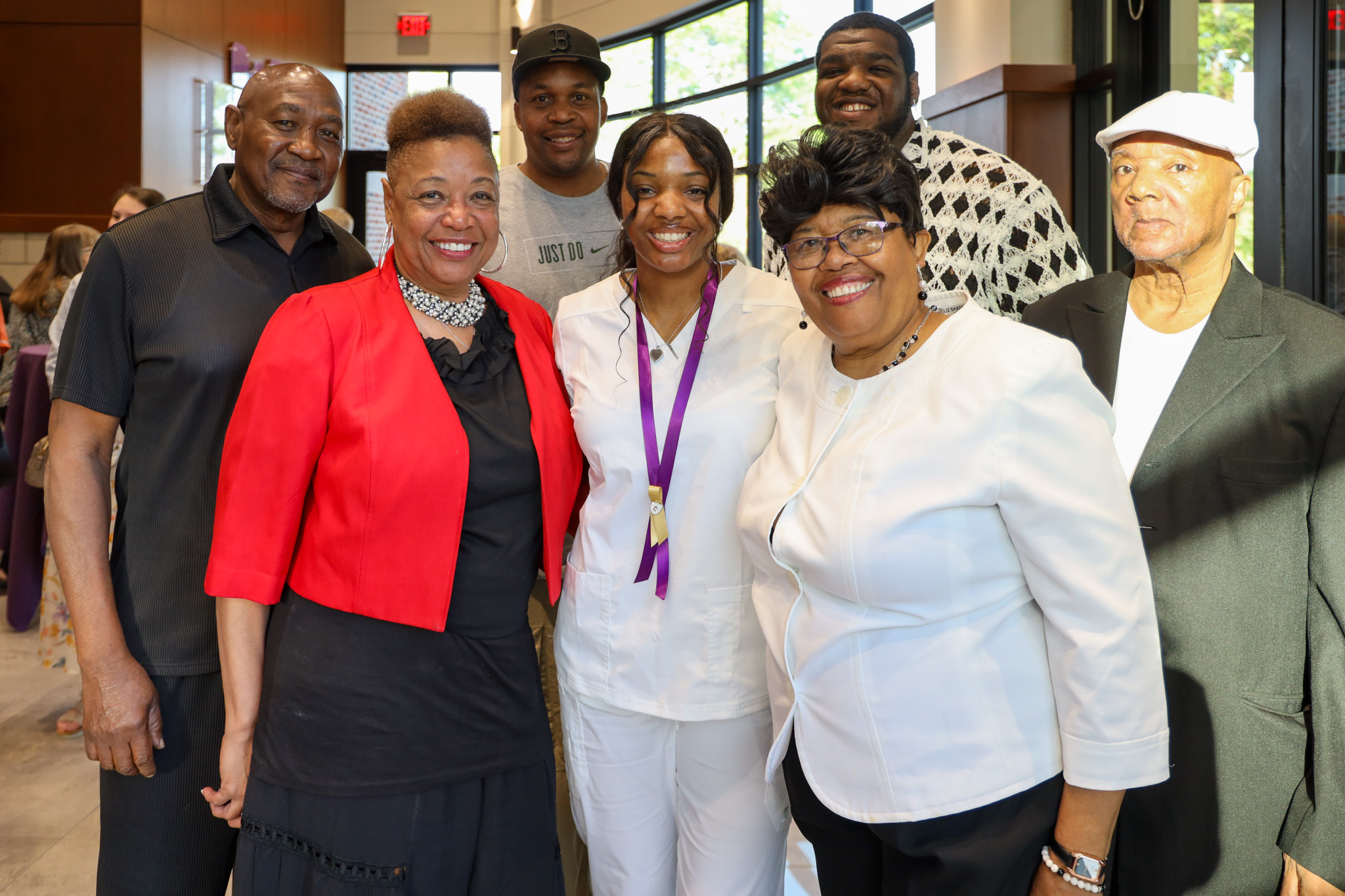 Family gathered together with Nursing grad