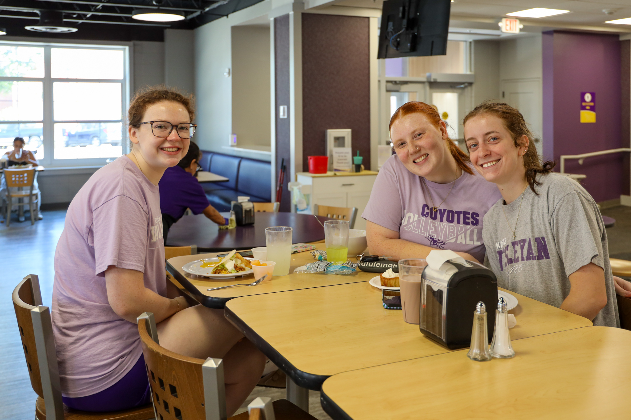 Three female students in dining hall