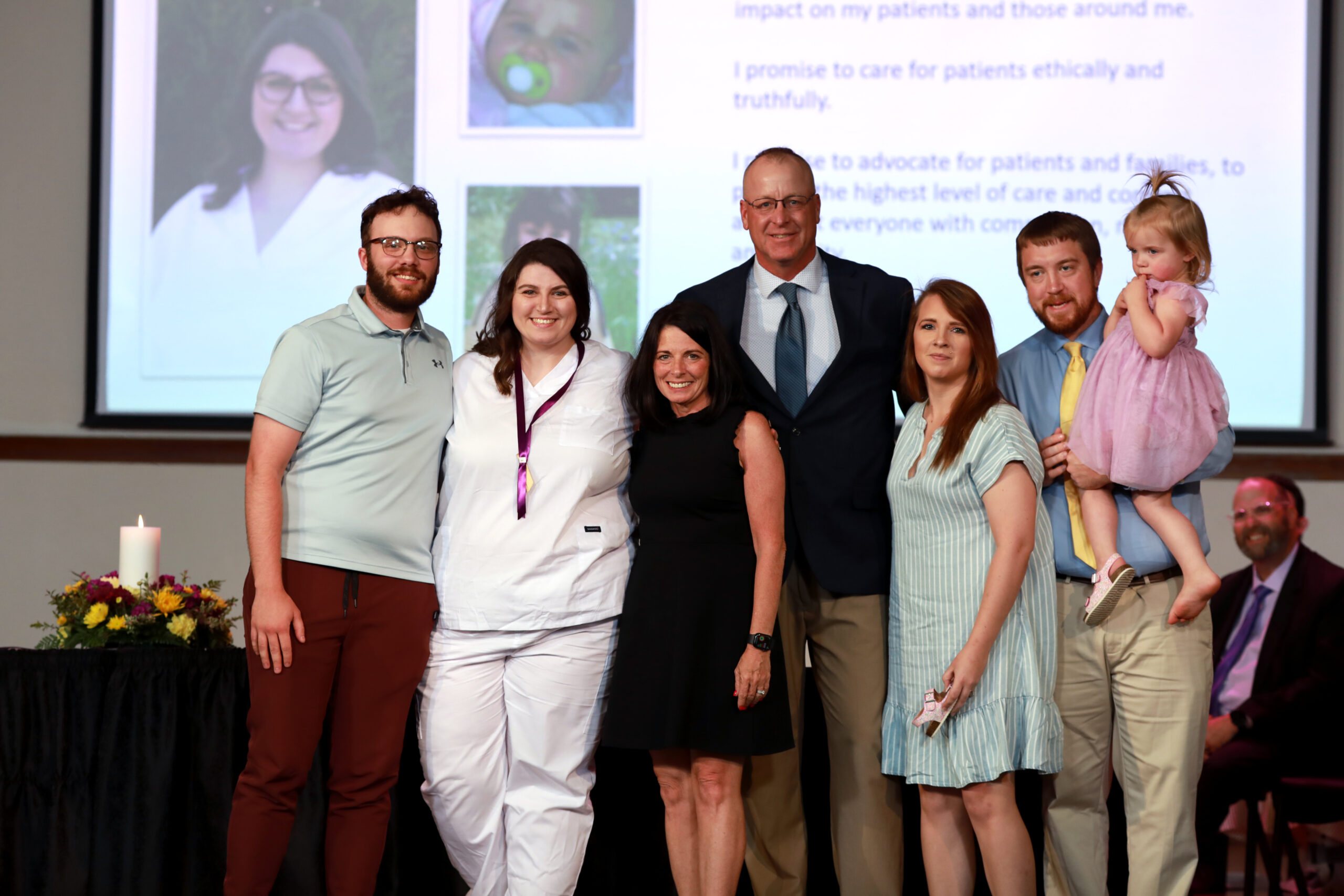 Nursing graduate with family