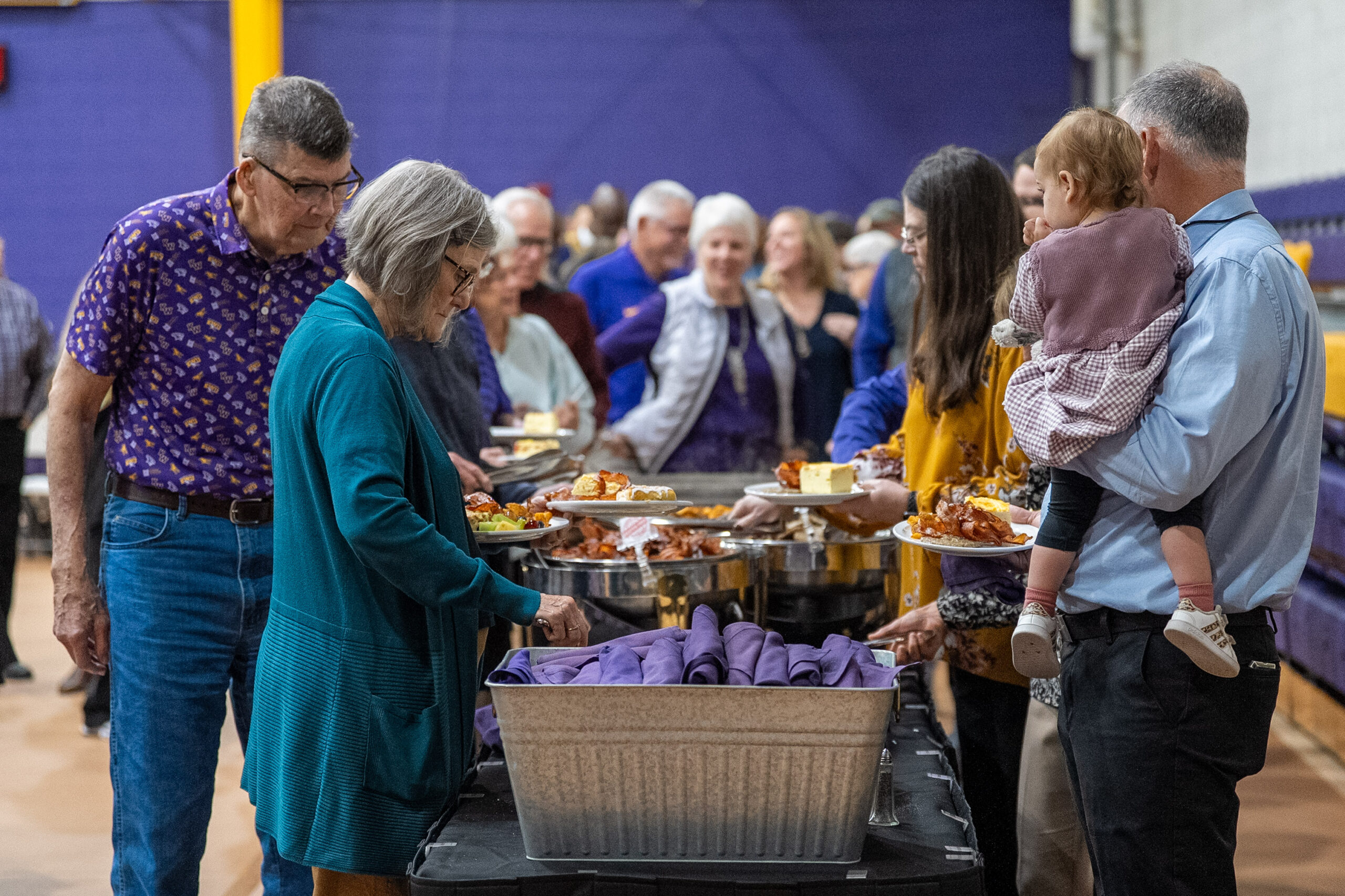 Group of people going through line to get food