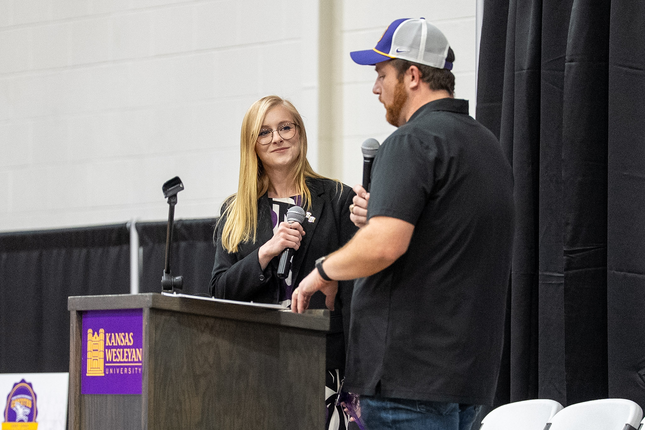 Woman listening at podium