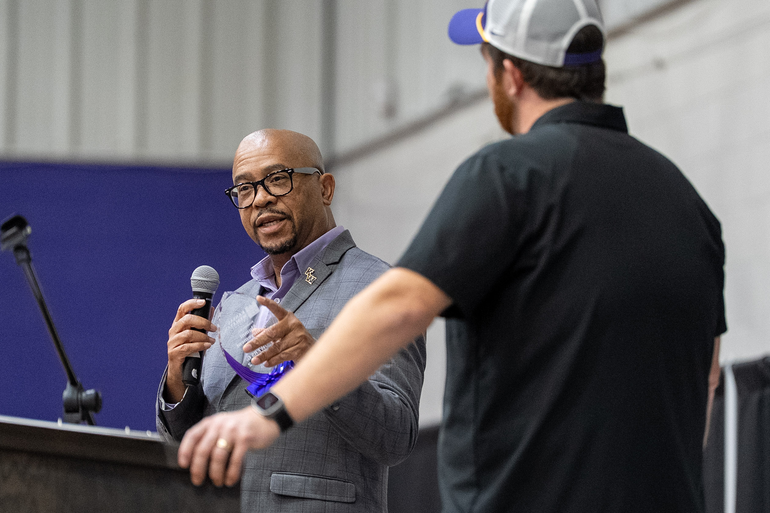 Man speaking at poodium