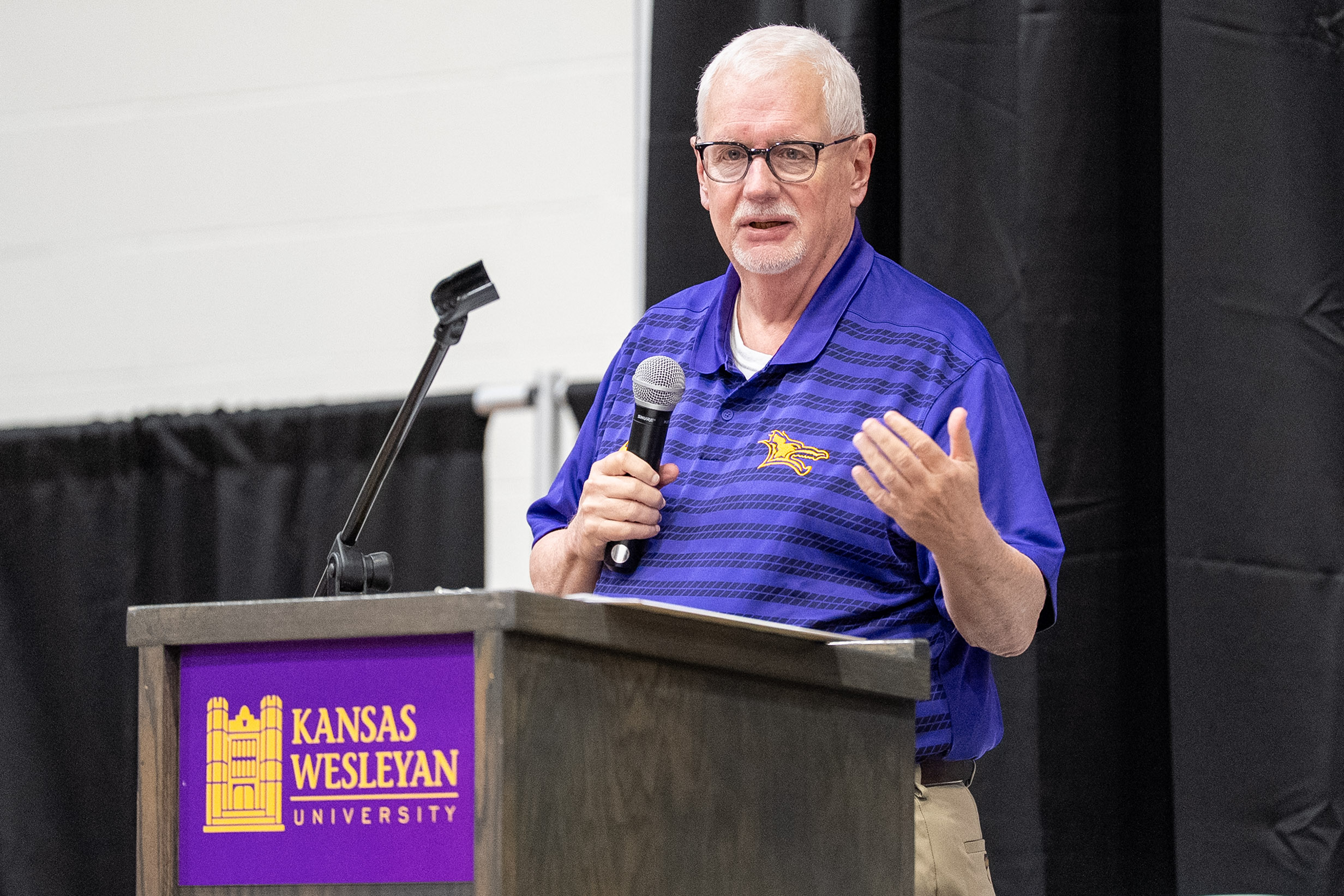 Man standing at podium speaking
