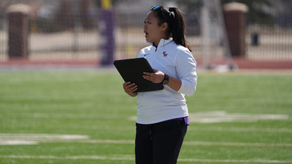 Female coach with clipboard