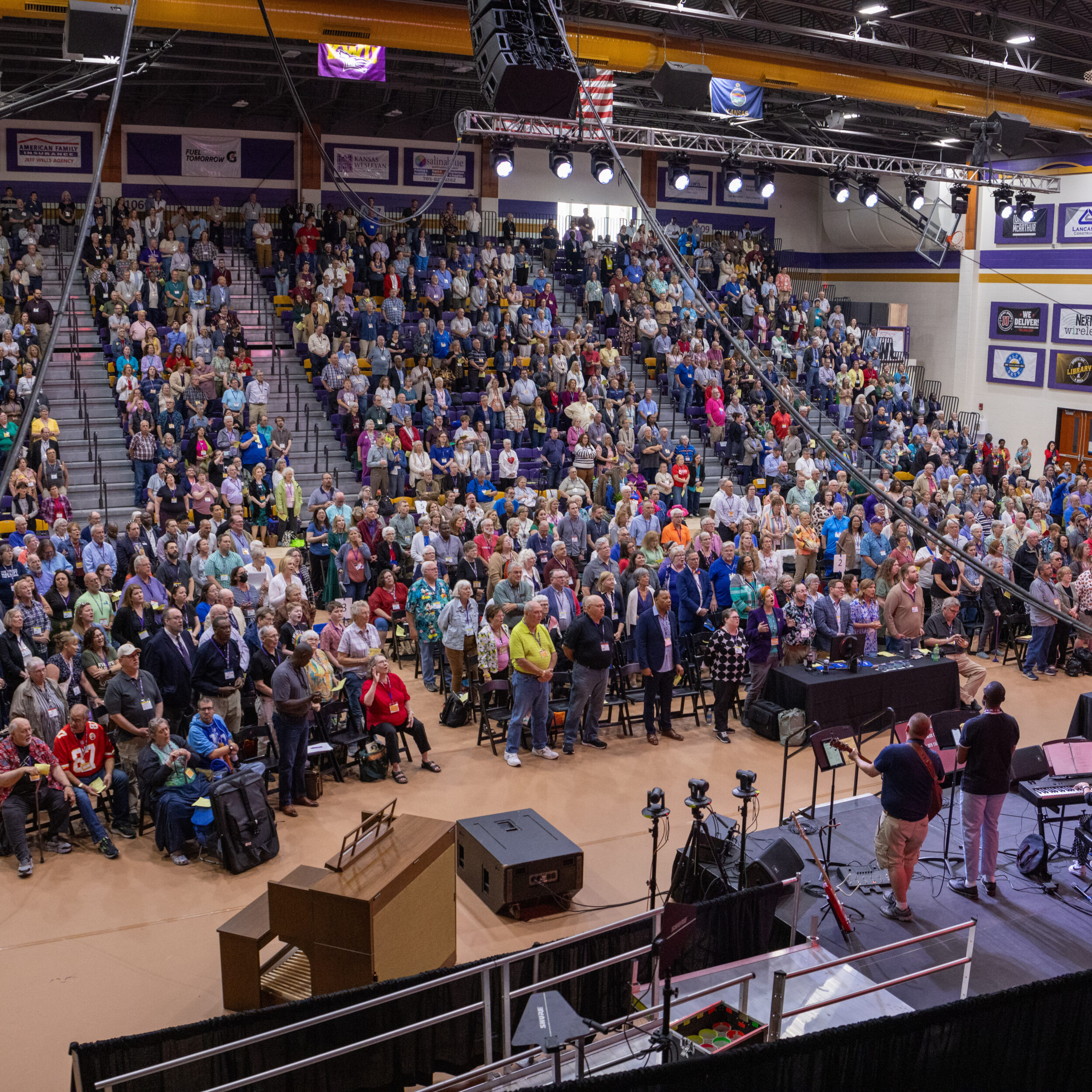 Wide-angle shot of capacity crowd in arena
