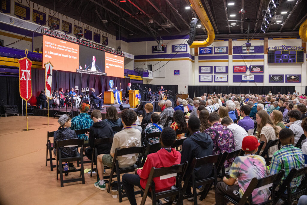 Wide angle shot of large audience in Mabee Arena