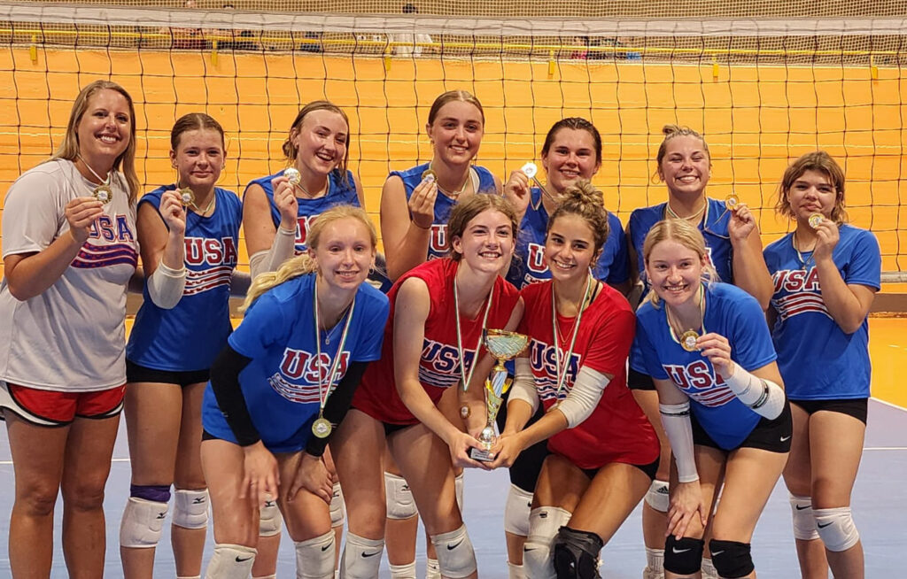 Biegert with team coached overseas