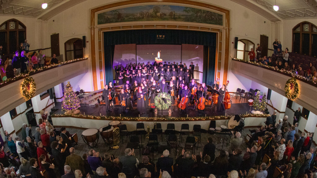 Choir performs during Christmas by Candlelight.
