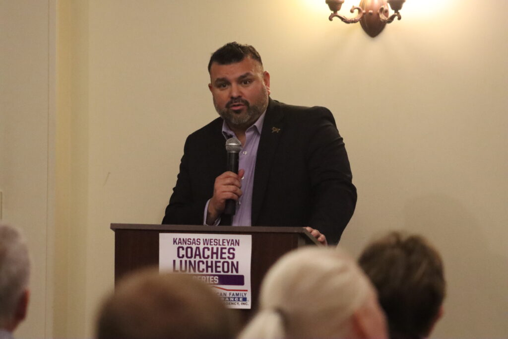 AD Miguel Paredes speaks at podium