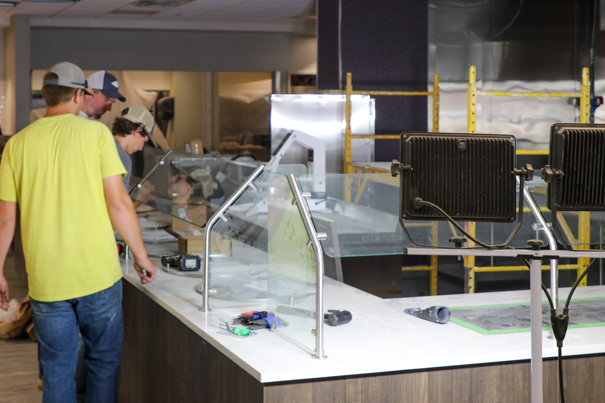 Men working construction around dining facility items