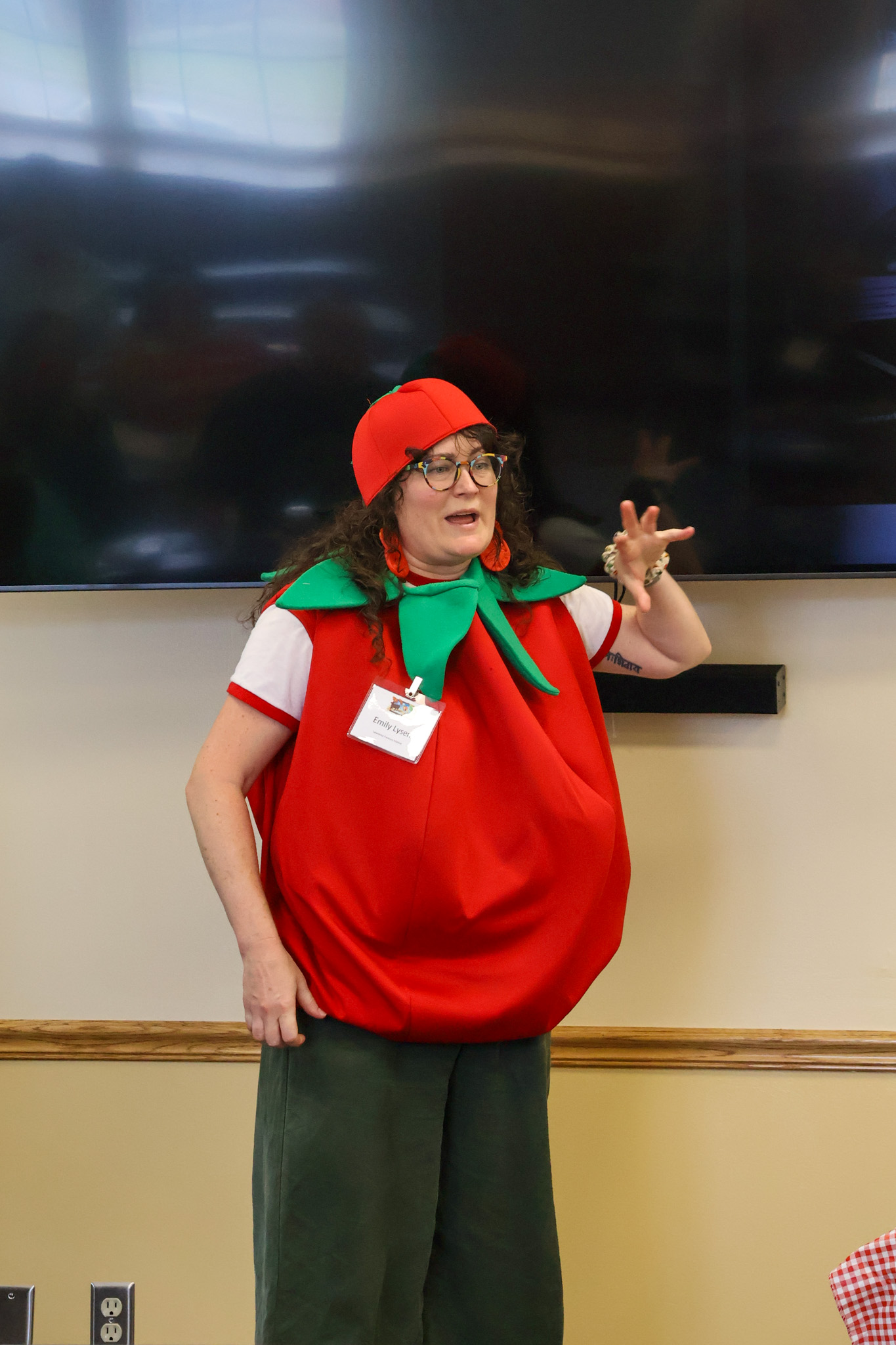 Woman dressed as apple talking