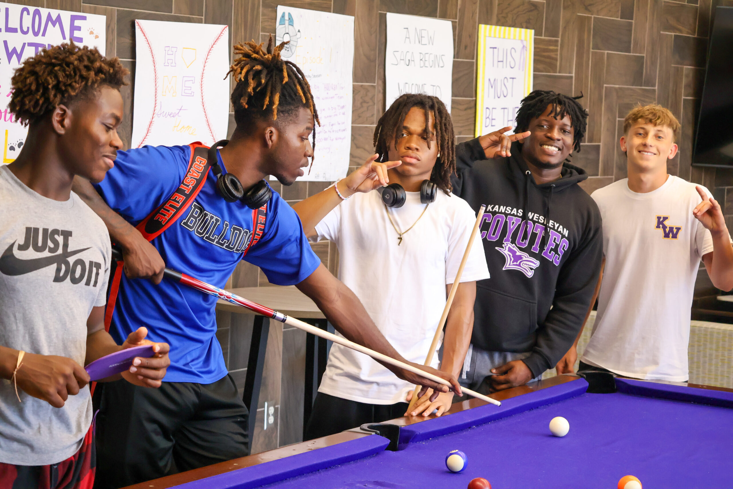 Group of male students playing pool