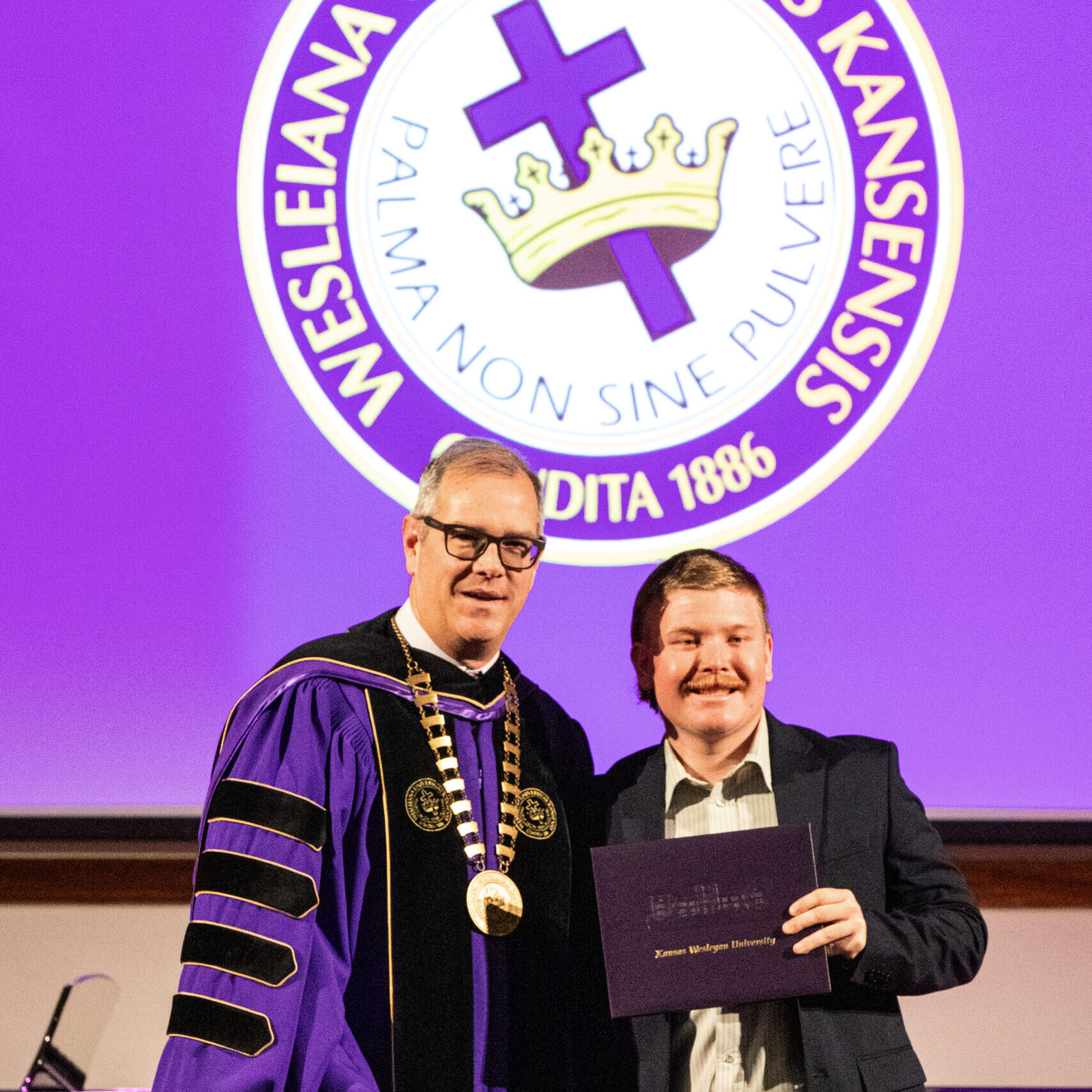 Man with diploma and president