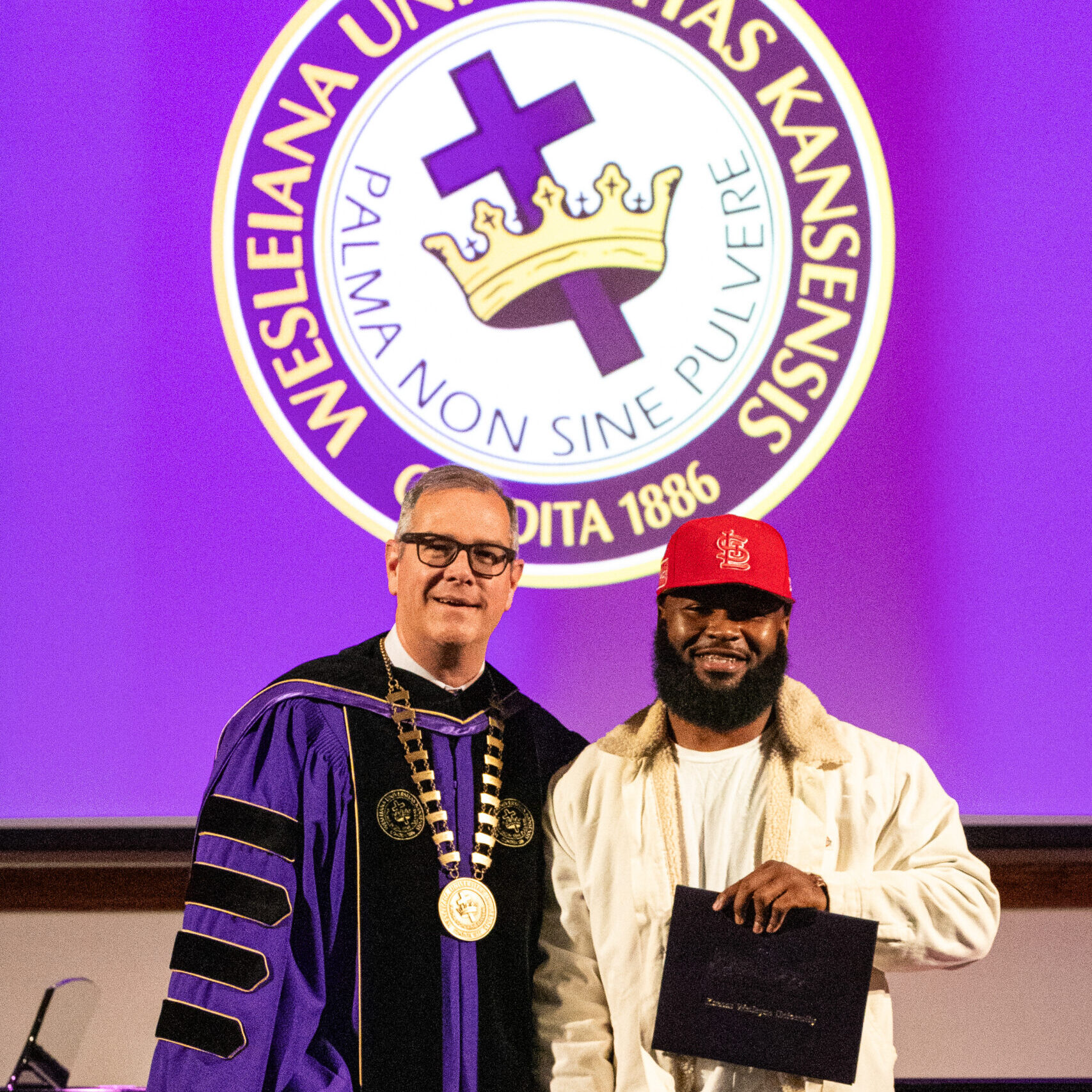 Man with diploma and president