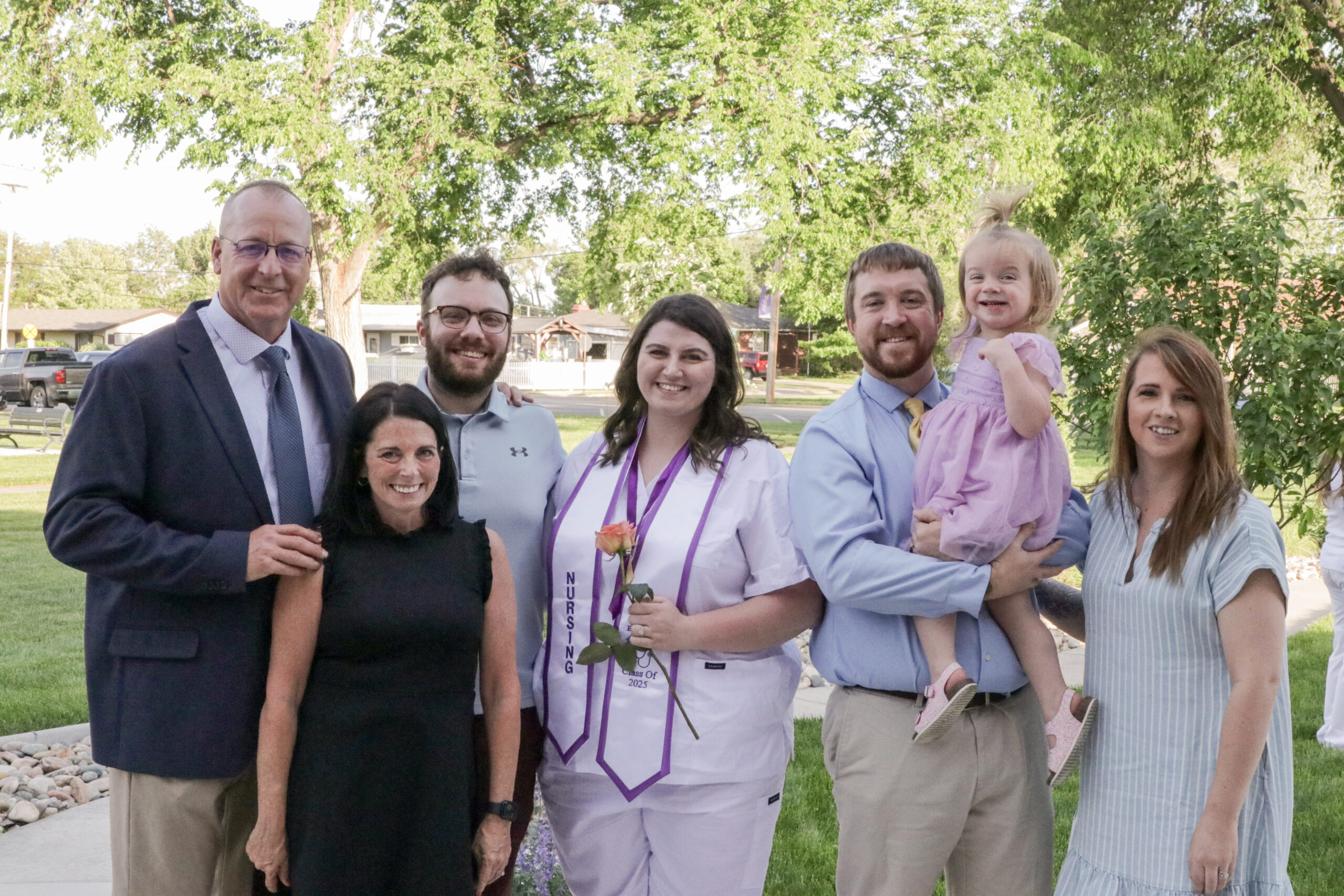 Family gathered together with Nursing grad