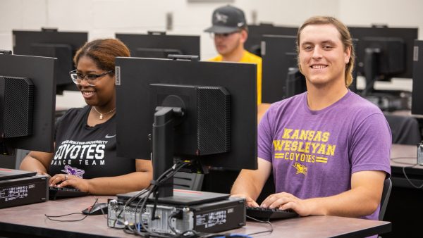 Student seated near computer