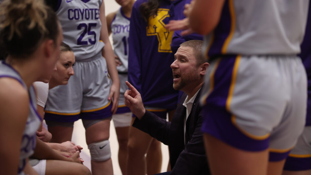 basketball coach in huddle