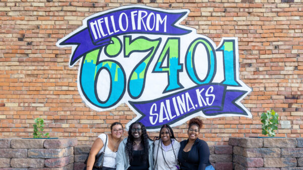 Group in front of 67401 sign